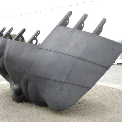 Photohraph of boat with a face sculpture made of steel called Merchan Seamans Memorial in Cardiff