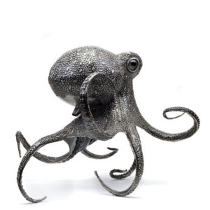 Metal Octopus statue photograph by George Fell