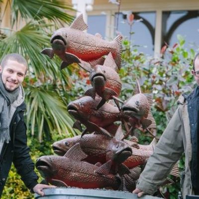 Photograph of Arctic Char Sculpture with artists Brian Fell and George Fell