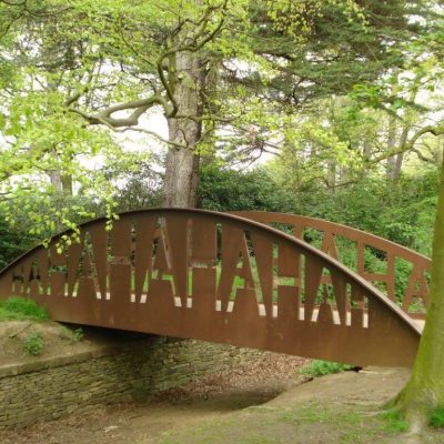 Photograph of a metal bridge crossing a Ha-Ha by Brian Fell